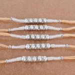 Shining Five Silver Diamond Studded Rakhi Combo